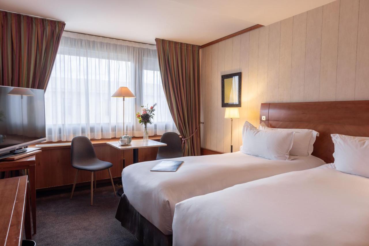 Sofitel Lyon Bellecour Hotel Bagian luar foto A typical room at the hotel